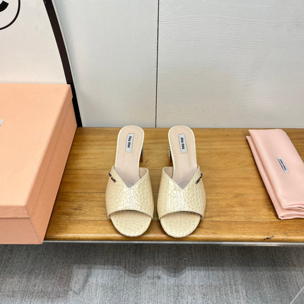 JEWELLED HEEL 55 MULE SANDALS IN PALE YELLOW CALFSKIN