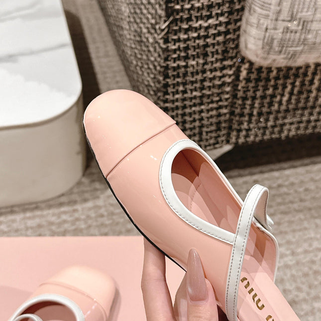 FLAT MULE IN PALE PINK PATENT CALFSKIN