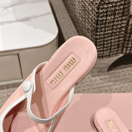 FLAT MULE IN PALE PINK PATENT CALFSKIN