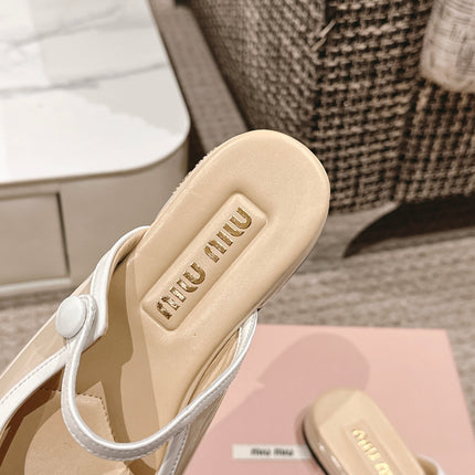 FLAT MULE IN BISQUE BEIGE PATENT CALFSKIN