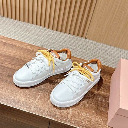 MM SNEAKERS IN WHITE CALFSKIN WITH YELLOW LACES
