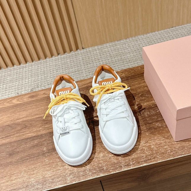 MM SNEAKERS IN WHITE CALFSKIN WITH YELLOW LACES