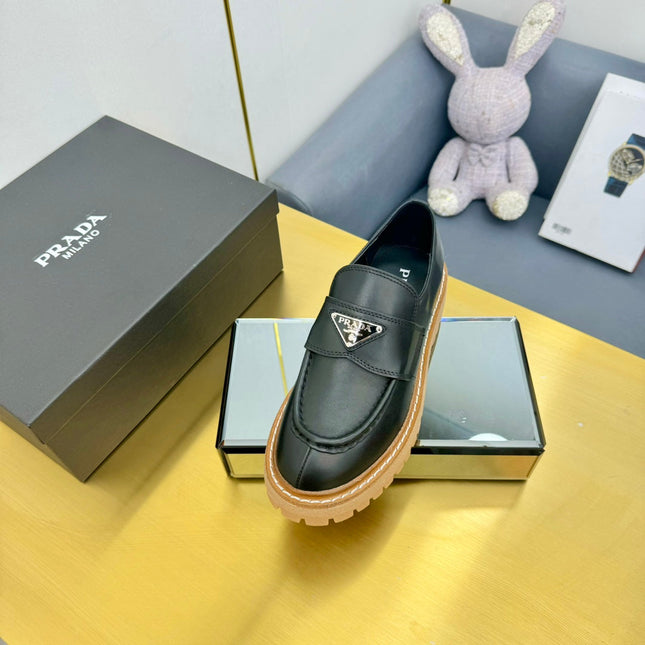 LOAFER WITH TRIANGLE LOGO IN BLACK CALFSKIN
