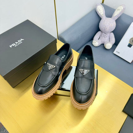 LOAFER WITH TRIANGLE LOGO IN BLACK CALFSKIN
