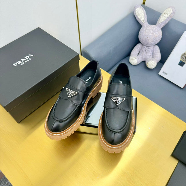 LOAFER WITH TRIANGLE LOGO IN BLACK CALFSKIN