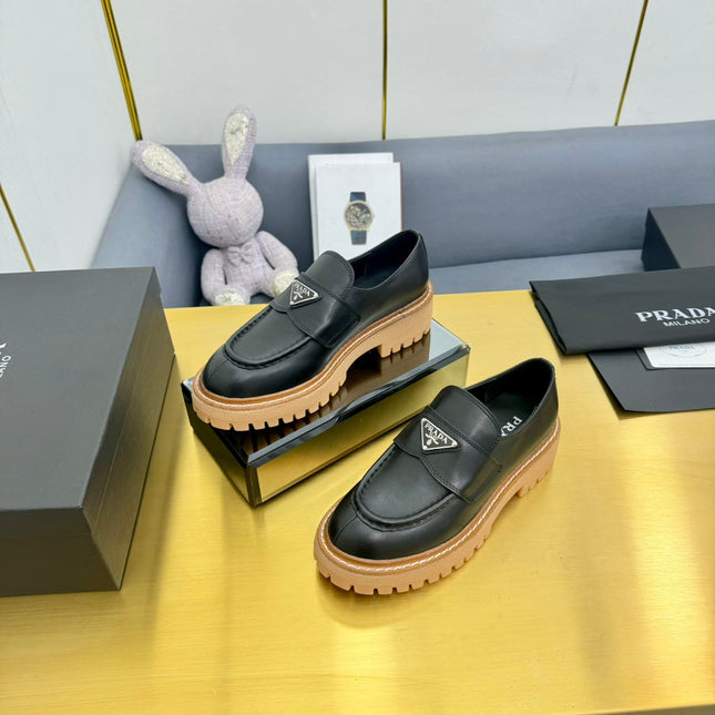 LOAFER WITH TRIANGLE LOGO IN BLACK CALFSKIN