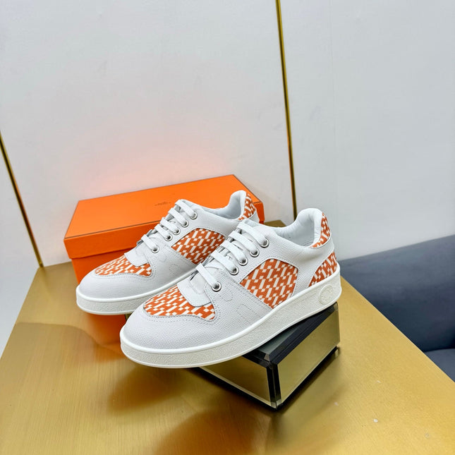 FREE SNEAKER IN WHITE CALFSKIN AND "H EN BIAIS" ORANGE CANVAS