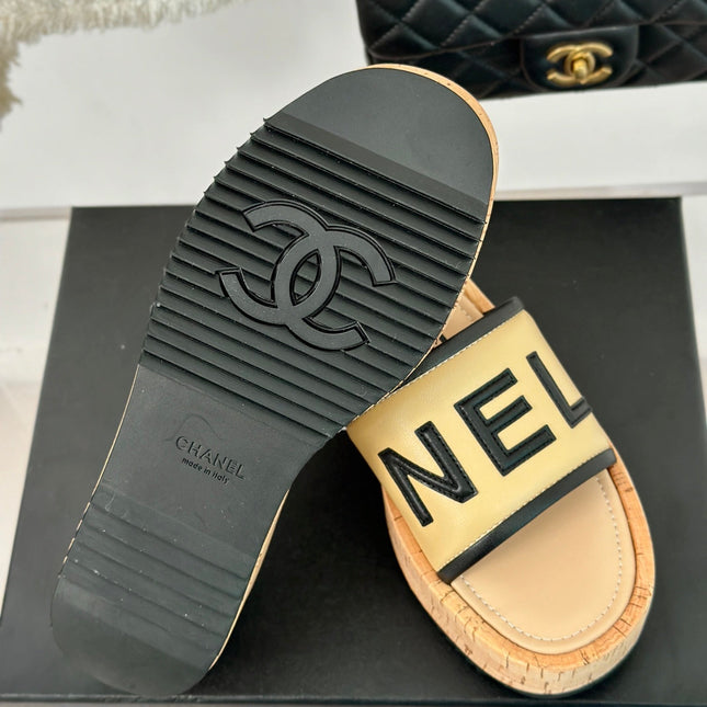 THICK SOLE LETTER SLIPPERS IN DARK CREAM SHEEPSKIN