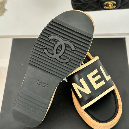 THICK SOLE LETTER SLIPPERS IN BLACK SHEEPSKIN