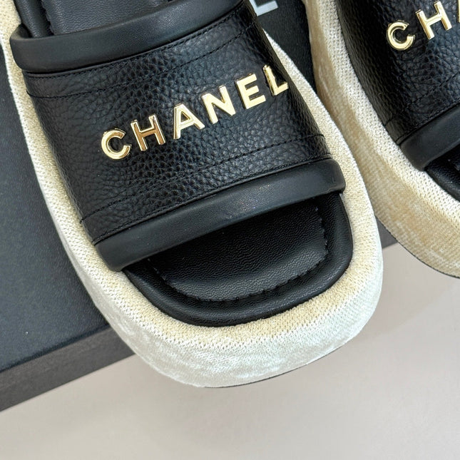 PLATFORM SLIPPERS IN BLACK LAMBSKIN