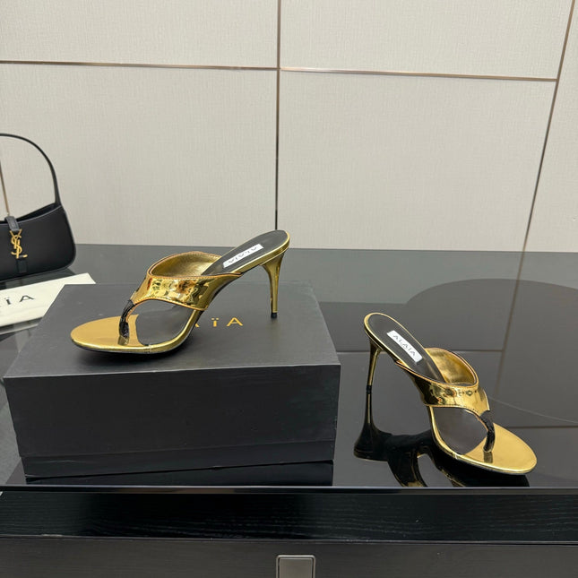 ALAIA HEELED THONG 25S IN GOLD PATENT LEATHER