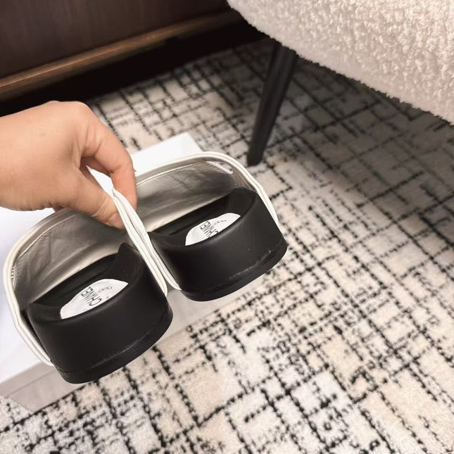 FLAT MULES IN WHITE CALFSKIN