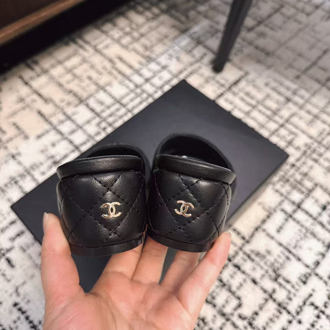 MID HEEL MULES IN BLACK SHEEPSKIN