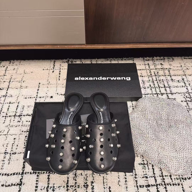 RHODES STUDDED FLAT MULE IN BLACK CALFSKIN