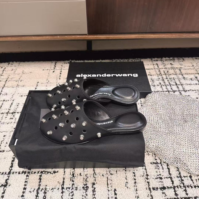 RHODES STUDDED FLAT MULE IN BLACK CALFSKIN