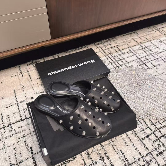 RHODES STUDDED FLAT MULE IN BLACK CALFSKIN