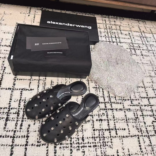 RHODES STUDDED FLAT MULE IN BLACK CALFSKIN