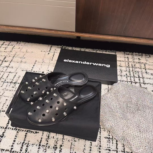 RHODES STUDDED FLAT MULE IN BLACK CALFSKIN