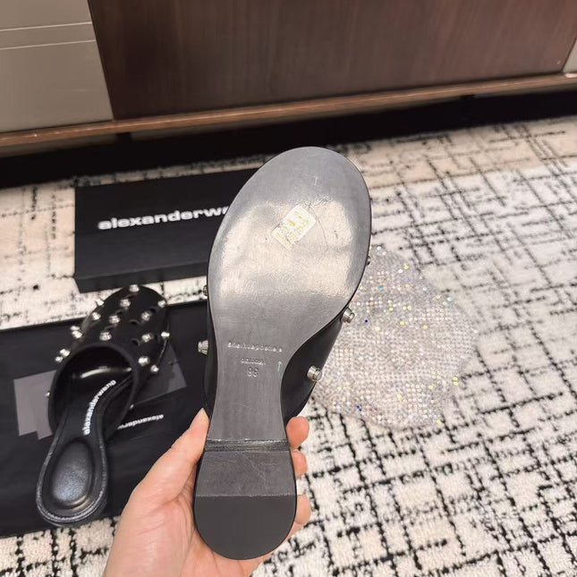 RHODES STUDDED FLAT MULE IN BLACK CALFSKIN