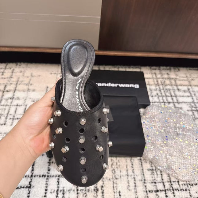 RHODES STUDDED FLAT MULE IN BLACK CALFSKIN