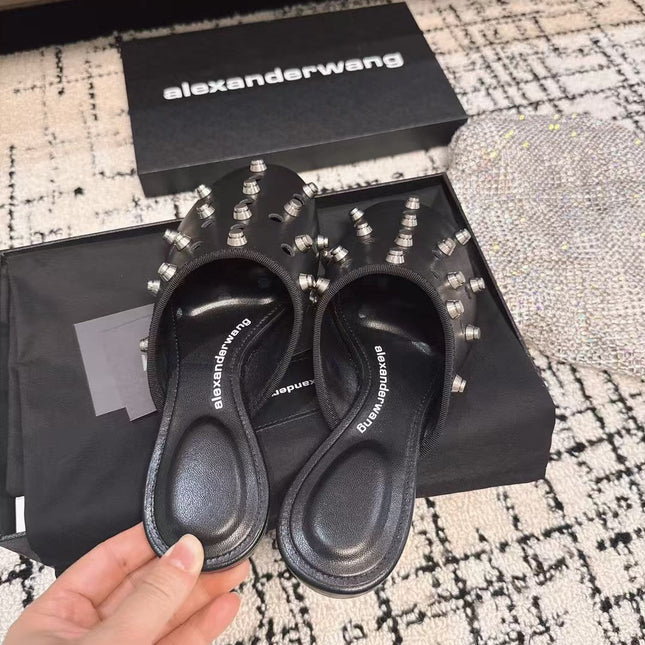 RHODES STUDDED FLAT MULE IN BLACK CALFSKIN