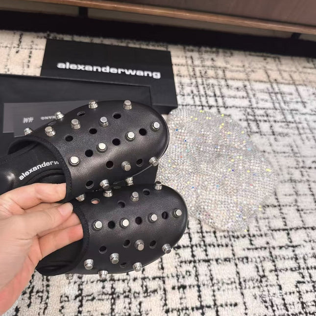 RHODES STUDDED FLAT MULE IN BLACK CALFSKIN