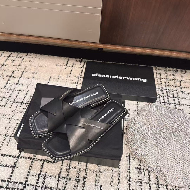 RHODES STUDDED SLIDE SANDAL IN BLACK CALFSKIN