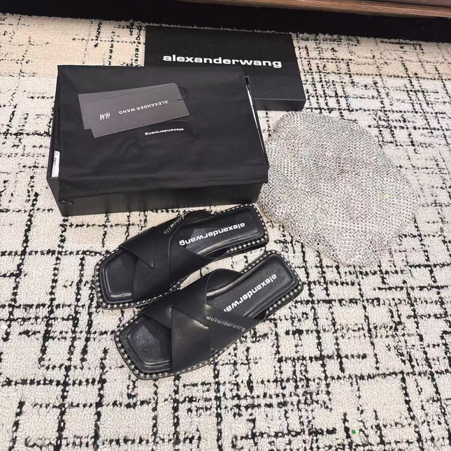 RHODES STUDDED SLIDE SANDAL IN BLACK CALFSKIN