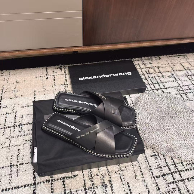 RHODES STUDDED SLIDE SANDAL IN BLACK CALFSKIN