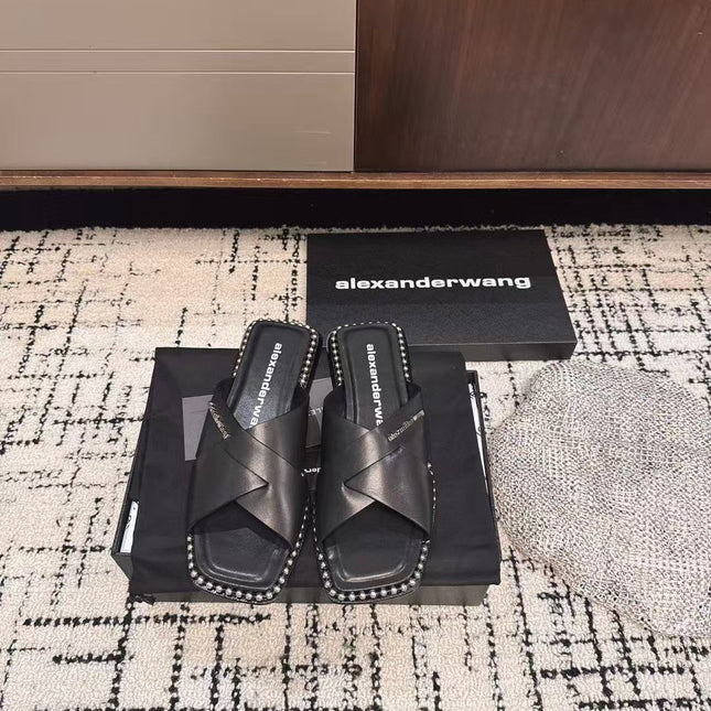 RHODES STUDDED SLIDE SANDAL IN BLACK CALFSKIN