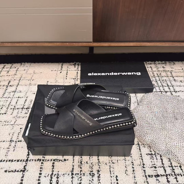 RHODES STUDDED SLIDE SANDAL IN BLACK CALFSKIN