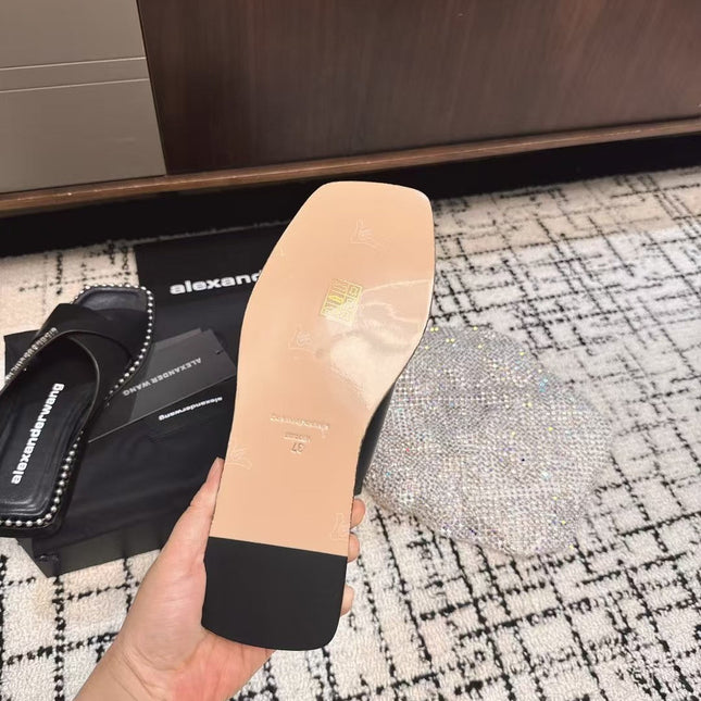 RHODES STUDDED SLIDE SANDAL IN BLACK CALFSKIN