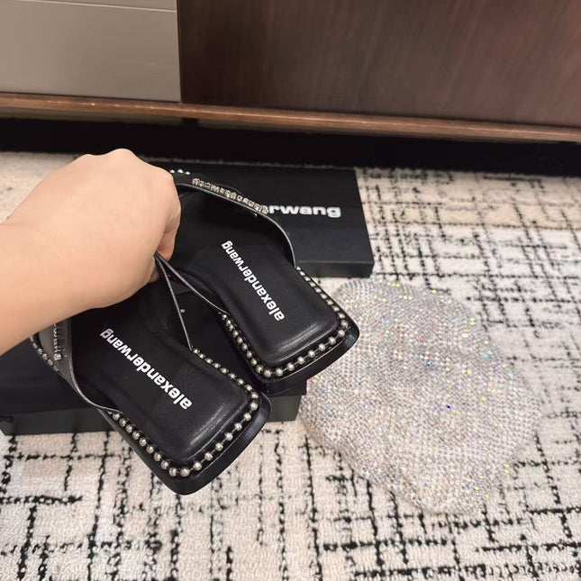 RHODES STUDDED SLIDE SANDAL IN BLACK CALFSKIN