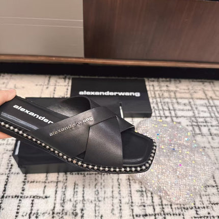 RHODES STUDDED SLIDE SANDAL IN BLACK CALFSKIN