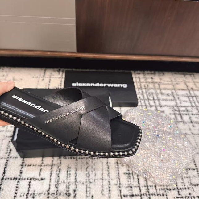 RHODES STUDDED SLIDE SANDAL IN BLACK CALFSKIN