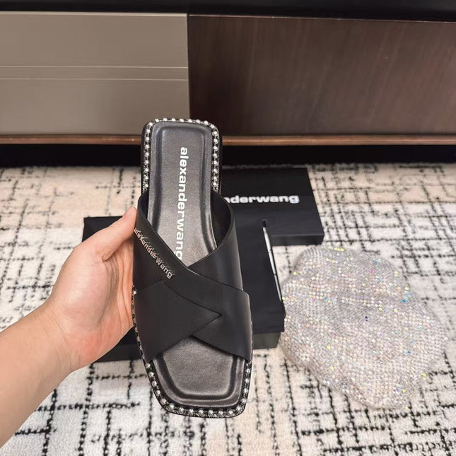 RHODES STUDDED SLIDE SANDAL IN BLACK CALFSKIN