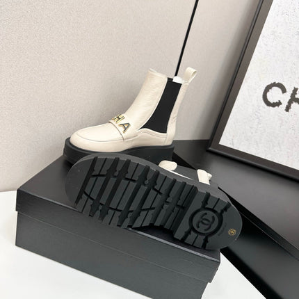 CHANEL 25S SHORT BOOTS IN WHITE CALFSKIN AND CANVAS