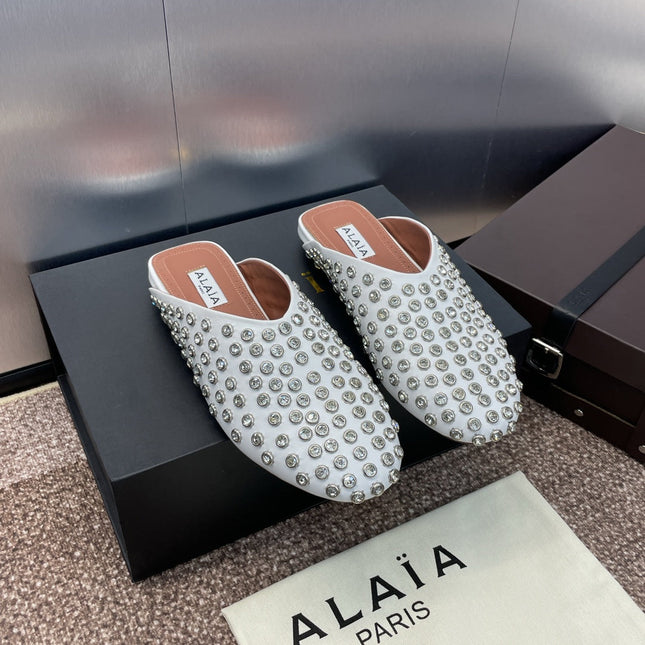 ALAIA FLAT MULES 25S IN WHITE LAMBSKIN EMBELLISHED WITH CRYSTALS