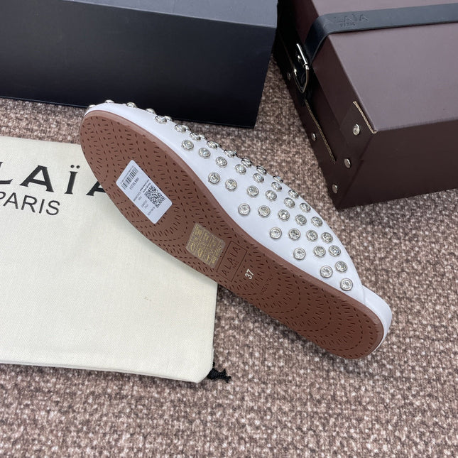 ALAIA FLAT MULES 25S IN WHITE LAMBSKIN EMBELLISHED WITH CRYSTALS