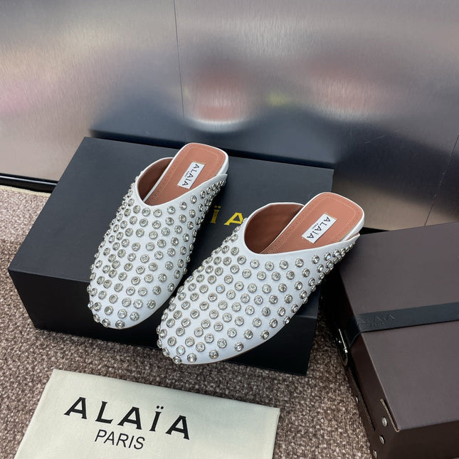 ALAIA FLAT MULES 25S IN WHITE LAMBSKIN EMBELLISHED WITH CRYSTALS