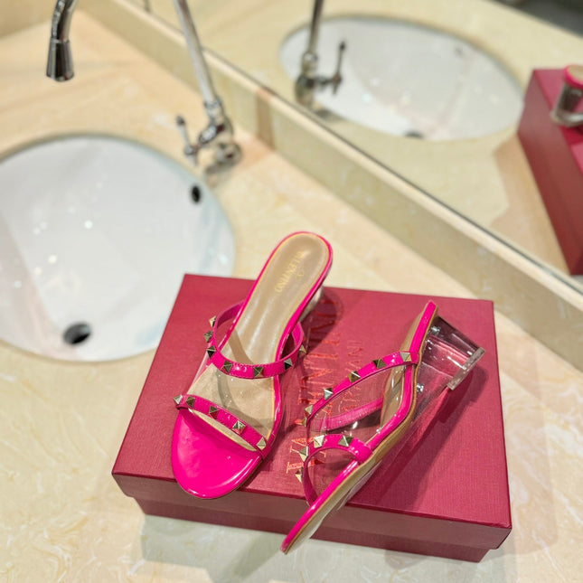 ROCKSTUD MULE SANDALS IN BRIGHT PINK CALFSKIN AND TRANSPARENT PVC FILM