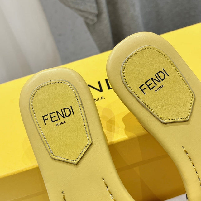 FENDI BAGUETTE SLIDES IN BRIGHT YELLOW LAMBSKIN
