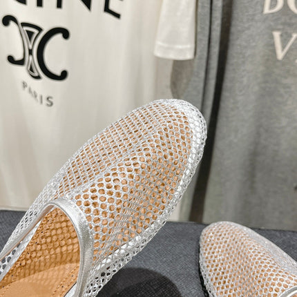 ALAIA FLAT MULES IN SILVER MESH FISHNET