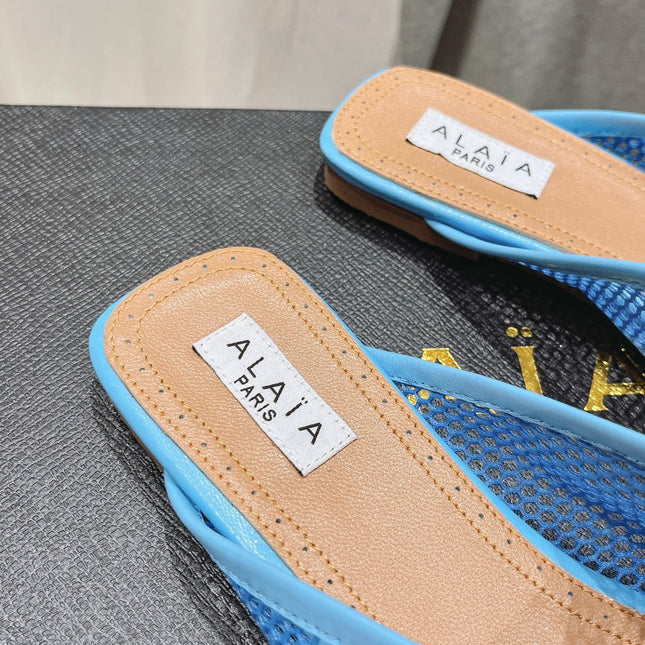 ALAIA FLAT MULES IN CERULEAN BLUE MESH FISHNET