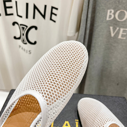 ALAIA FLAT MULES IN WHITE MESH FISHNET