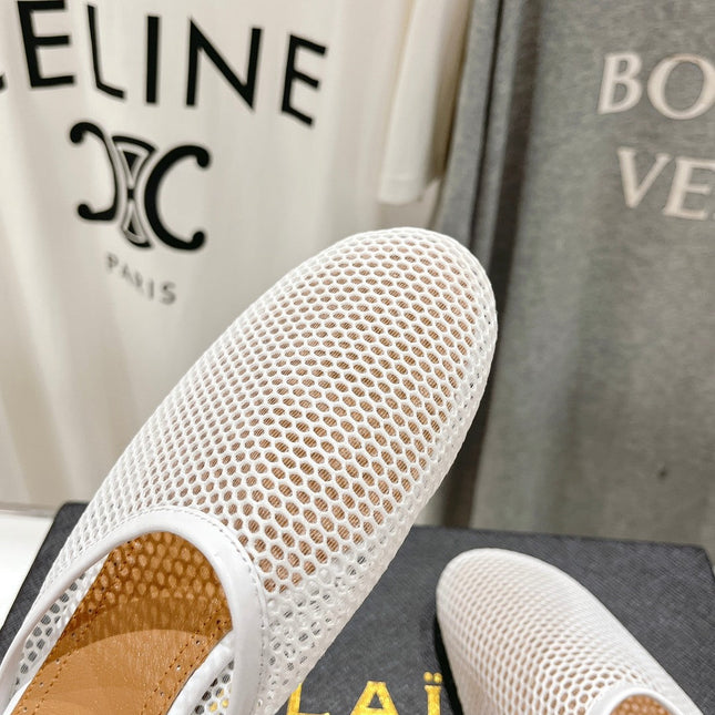 ALAIA FLAT MULES IN WHITE MESH FISHNET