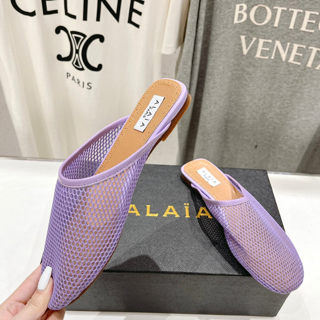 ALAIA FLAT MULES IN LIGHT PURPLE MESH FISHNET