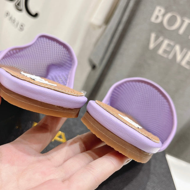 ALAIA FLAT MULES IN LIGHT PURPLE MESH FISHNET