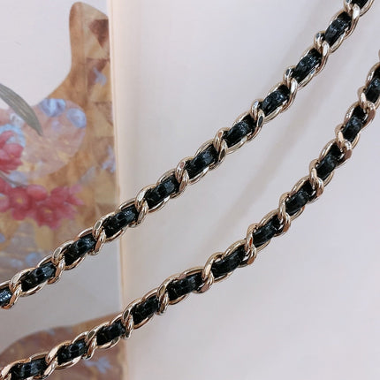 CHAIN BELT IN GOLD METAL INTERWOVEN WITH CALFSKIN STRAPS