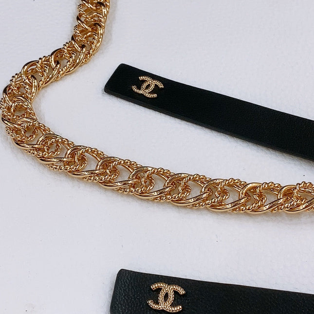 RIBBED BOW WAIST CHAIN IN GOLD TONE BRASS AND BLACK LAMBSKIN